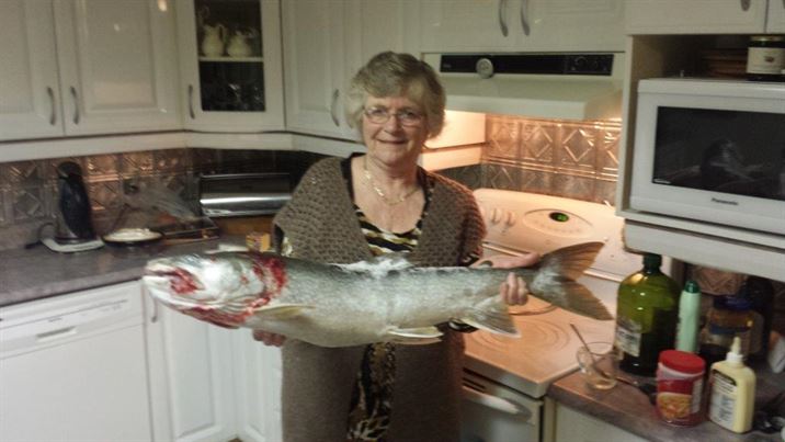 Image of Bonnie Holding an 11 lb Lake Trout caught in Larder Lake